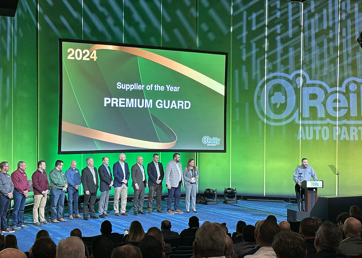 pgi team on stage to accept to awards from o'reilly auto parts at leadership conference