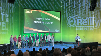 pgi team on stage to accept to awards from o'reilly auto parts at leadership conference