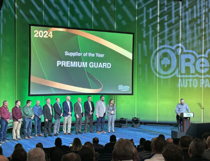 pgi team on stage to accept to awards from o'reilly auto parts at leadership conference