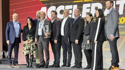 premium guard team stands on stage to accept advance auto parts' inaugural Professional Excellence Champion award.
