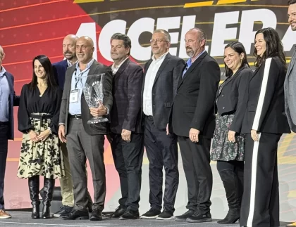 premium guard team stands on stage to accept advance auto parts' inaugural Professional Excellence Champion award.